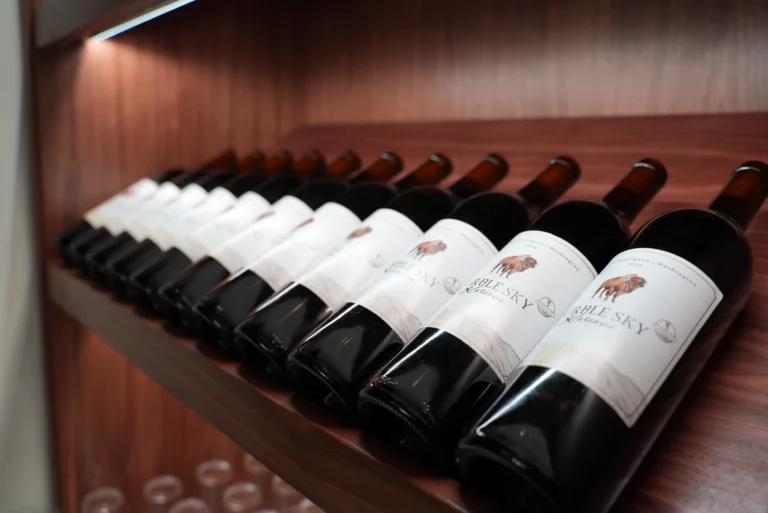 Purple sky winery wine bottles on display.