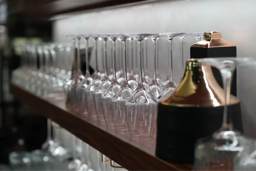 Glasses on shelves at purple sky winery.