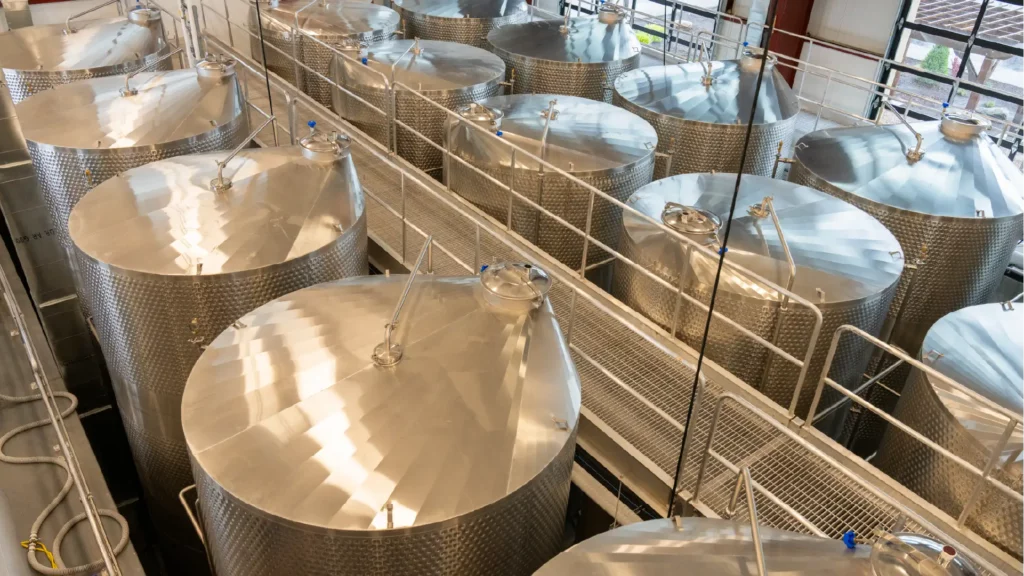 Top view of large fermentation vats at purple sky winery.