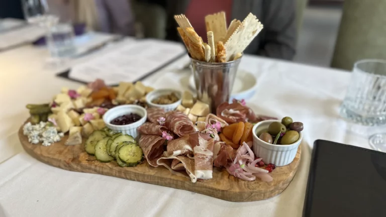 Charcuterie board on table at purple sky winery restaurant.