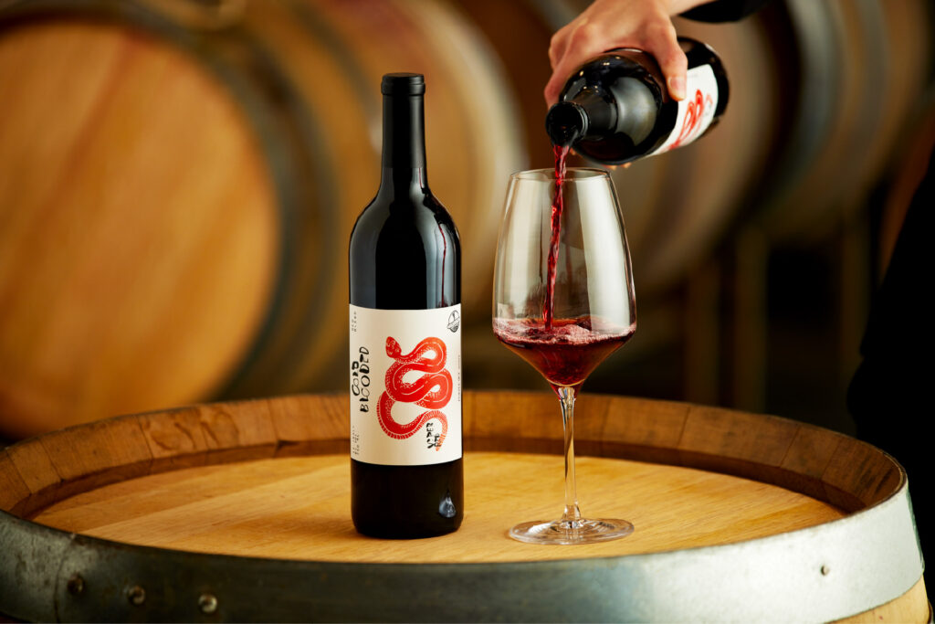 Purple sky winery bottle of 2024 viper red with glass being poured.